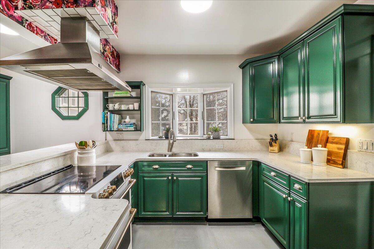 212 West Avenue Darien, CT 06820 - Photo 13 of 40 a kitchen with a sink stove and cabinets
