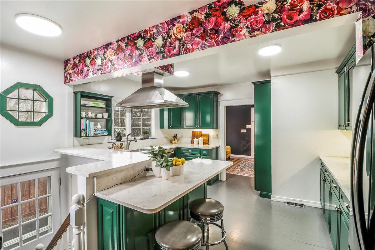 212 West Avenue Darien, CT 06820 - Photo 14 of 40 a dinning room with furniture and a chandelier