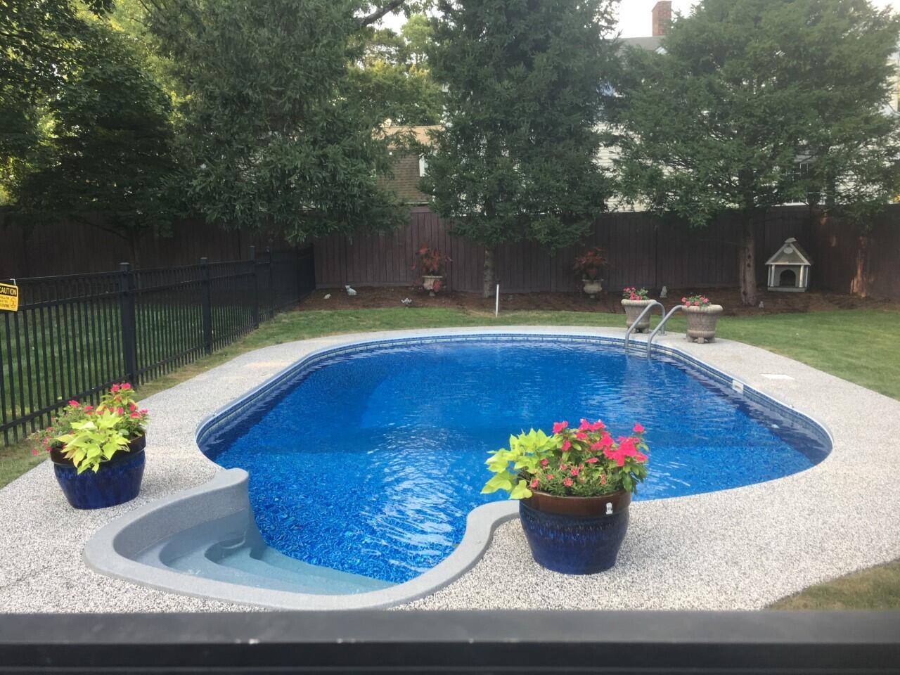 212 West Avenue Darien, CT 06820 - Photo 2 of 40 a view of a fountain and a table in the patio