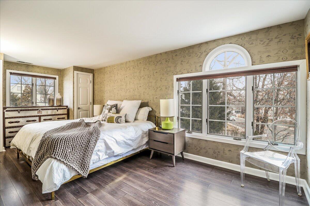 212 West Avenue Darien, CT 06820 - Photo 22 of 40 a bedroom with a bed and a large window