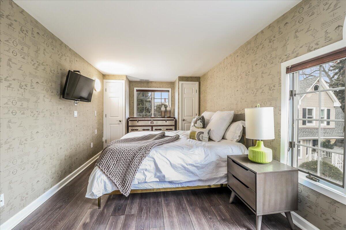 212 West Avenue Darien, CT 06820 - Photo 23 of 40 a bedroom with a bed a flat screen tv and dresser