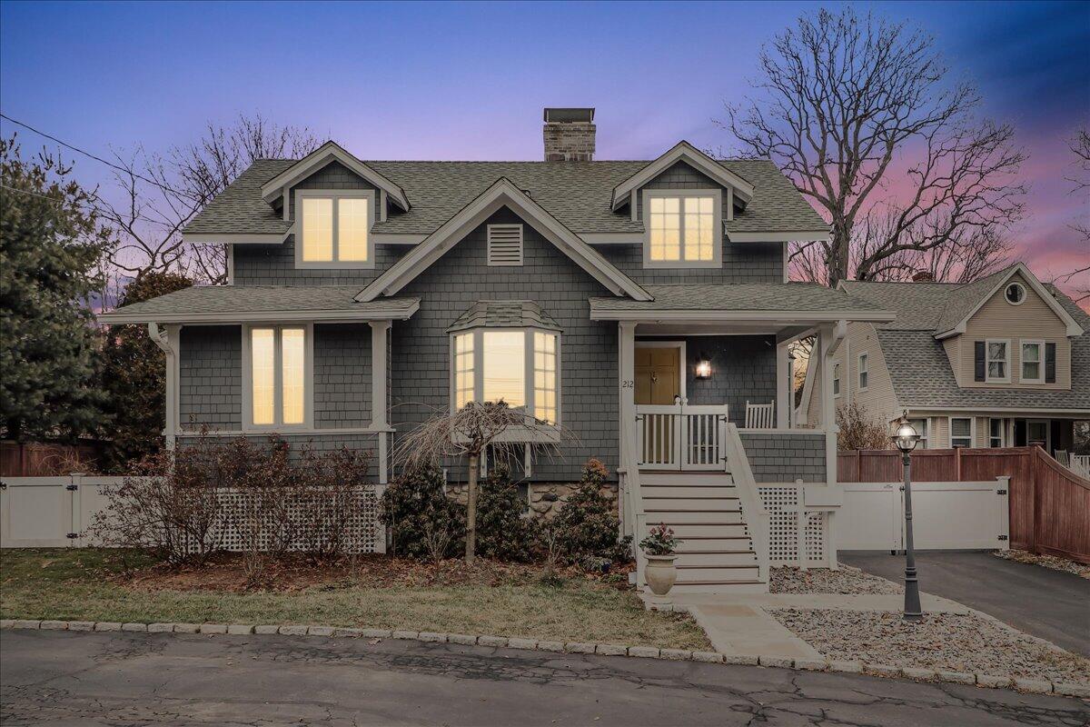 212 West Avenue Darien, CT 06820 - Photo 34 of 40 a front view of a house with a yard