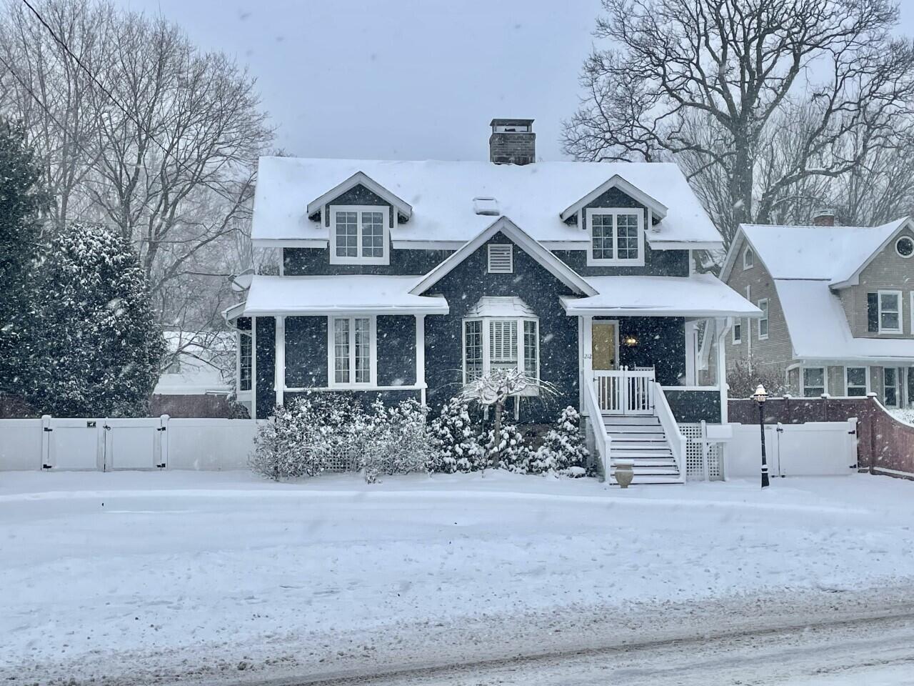 212 West Avenue Darien, CT 06820 - Photo 35 of 40 a front view of a house with a yard