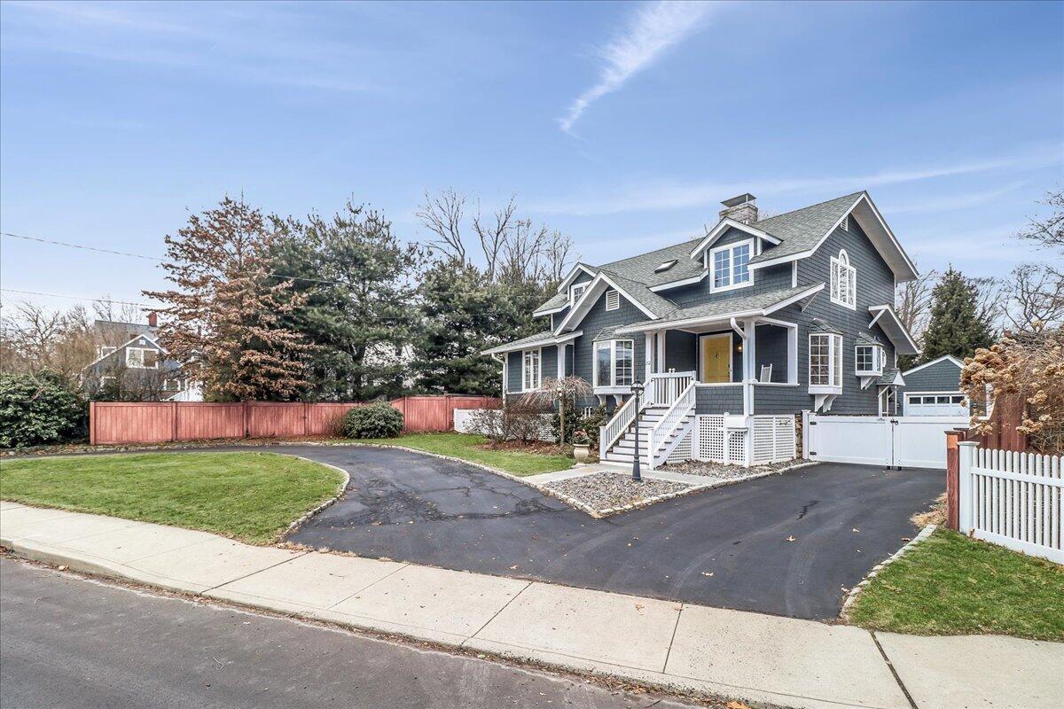 212 West Avenue Darien, CT 06820 - Photo 37 of 40 a front view of a house with garden