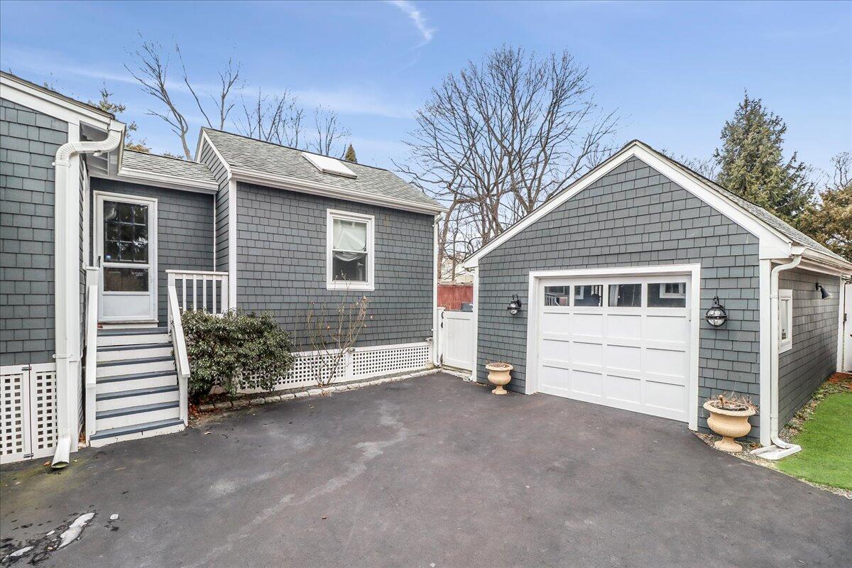 212 West Avenue Darien, CT 06820 - Photo 38 of 40 a view of a house with a garage