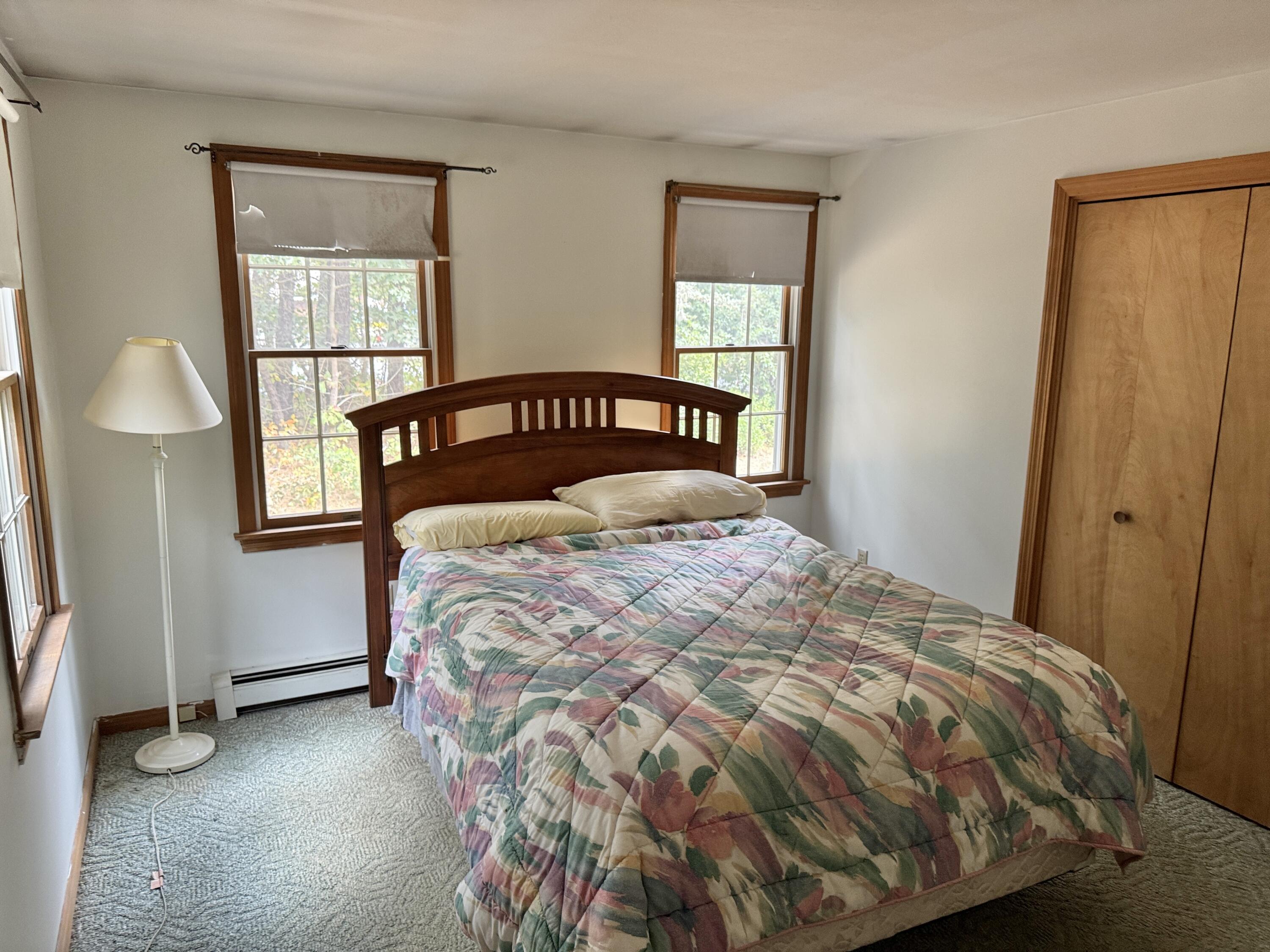 255 Massasoit Road Eastham, MA 02642 - Photo 15 of 25 a bedroom with a bed and a window