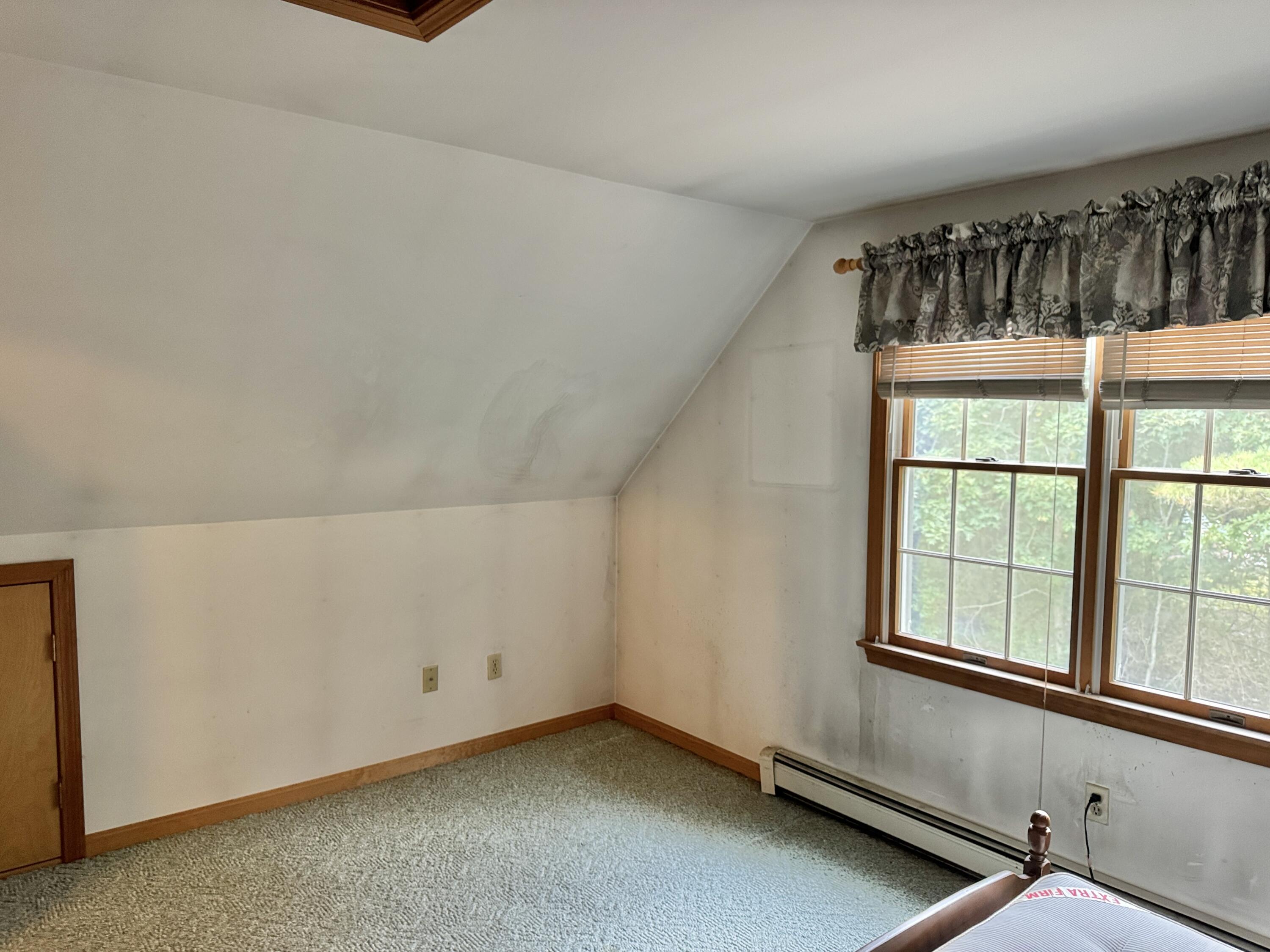 255 Massasoit Road Eastham, MA 02642 - Photo 20 of 25 a view of an empty room and window