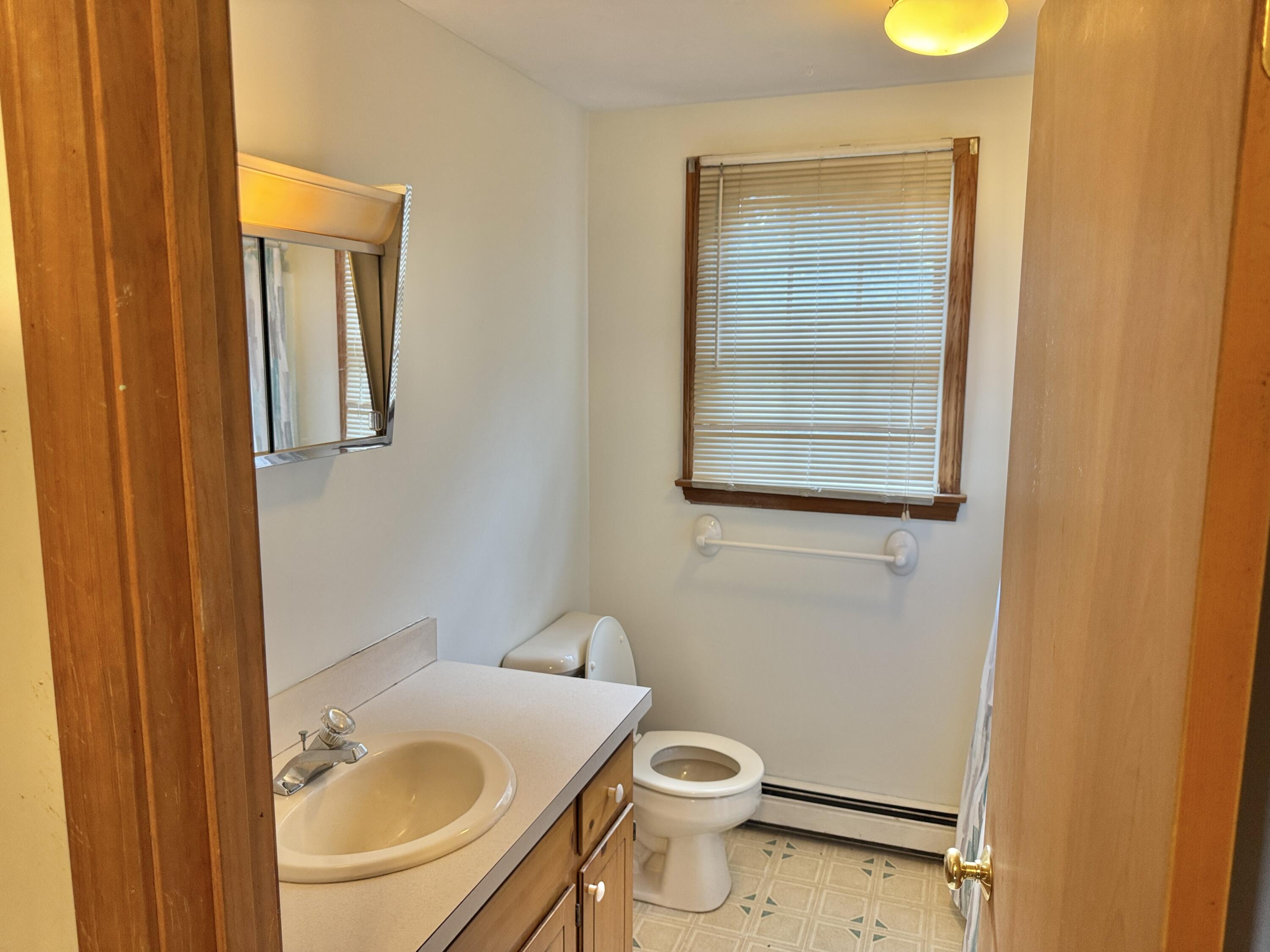 255 Massasoit Road Eastham, MA 02642 - Photo 21 of 25 a bathroom with a sink and a toilet