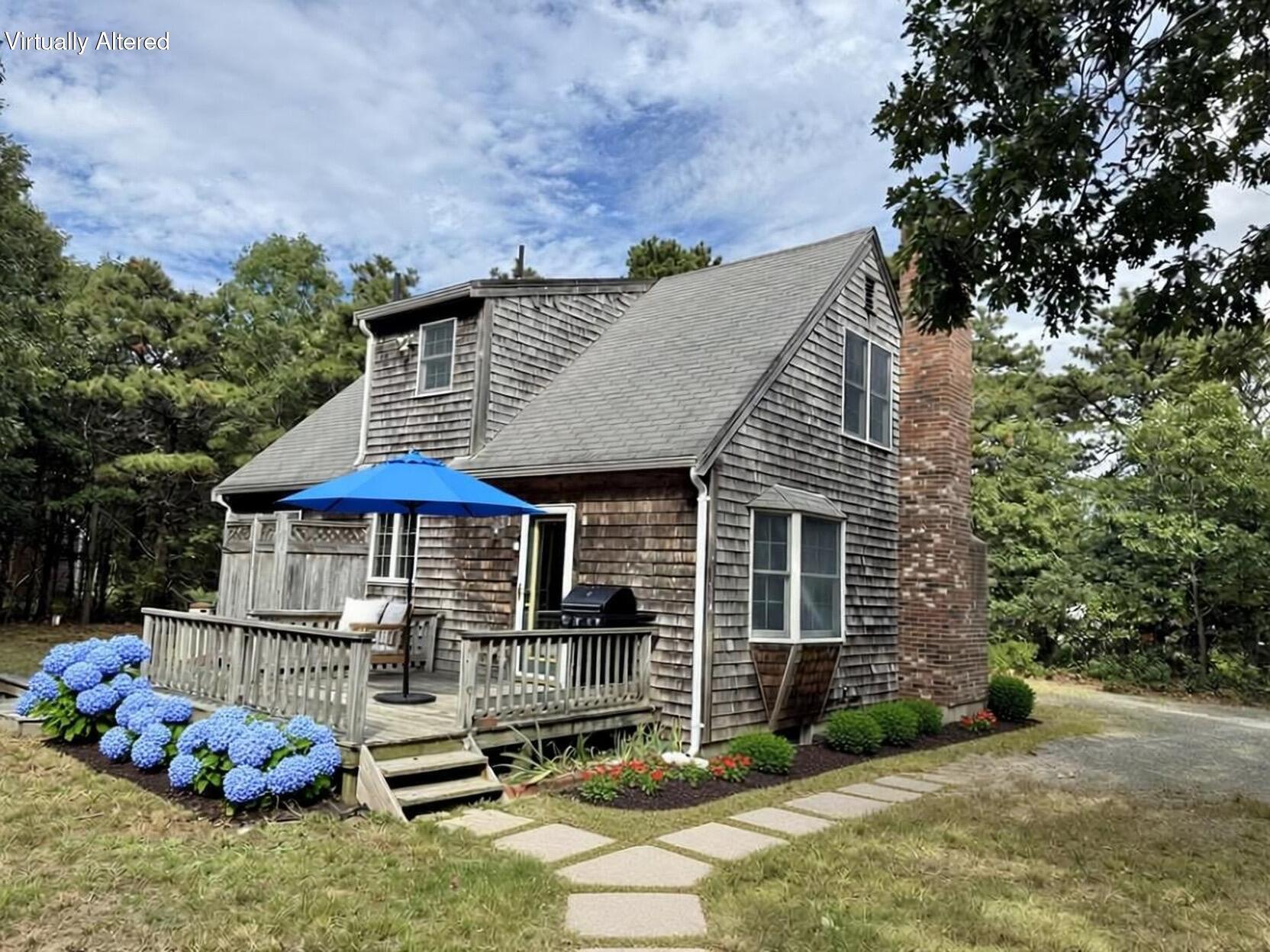 255 Massasoit Road Eastham, MA 02642 - Photo 5 of 25 a front view of a house with garden