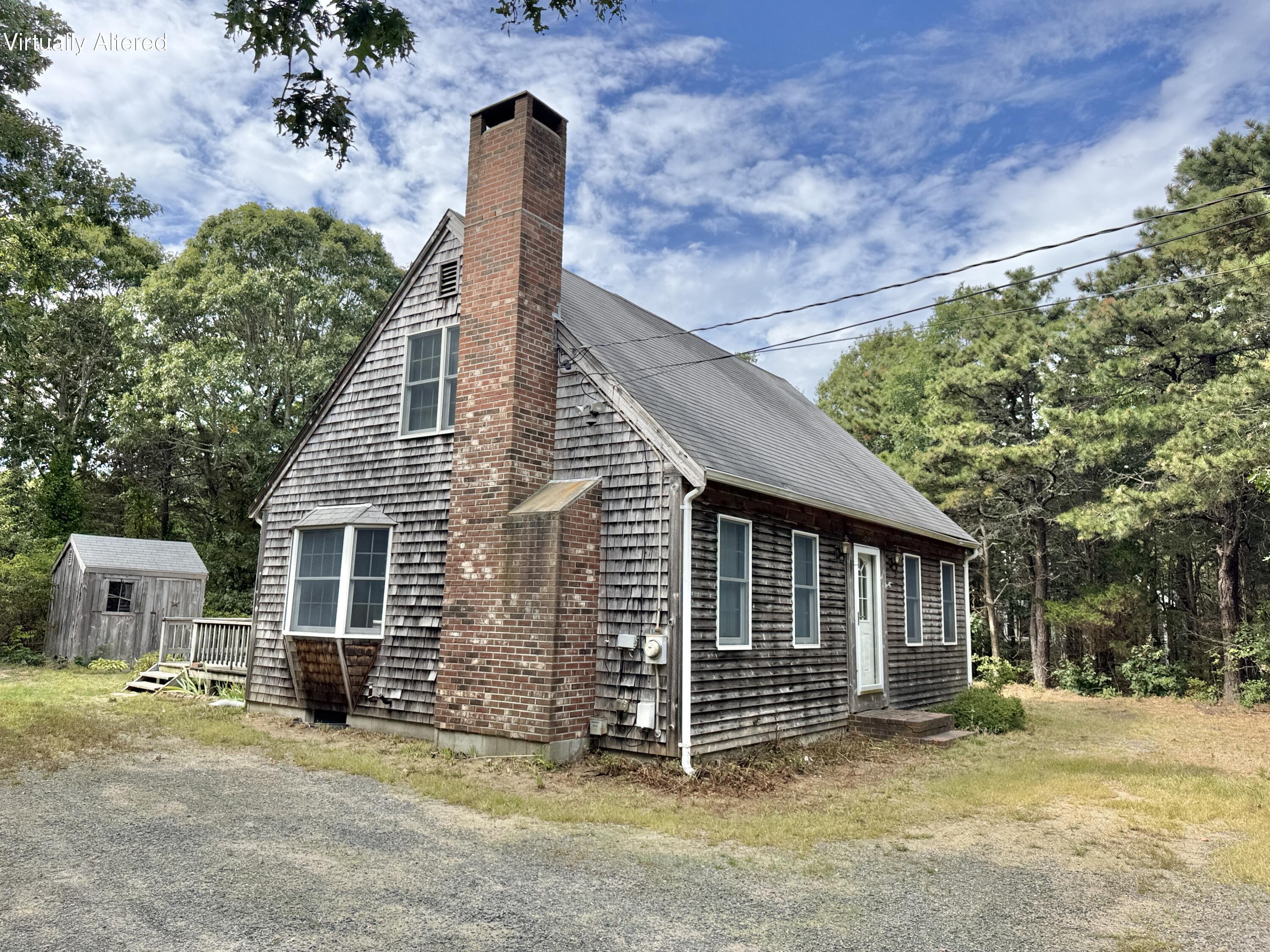 255 Massasoit Road Eastham, MA 02642 - Photo 8 of 25 a view of a house with a yard
