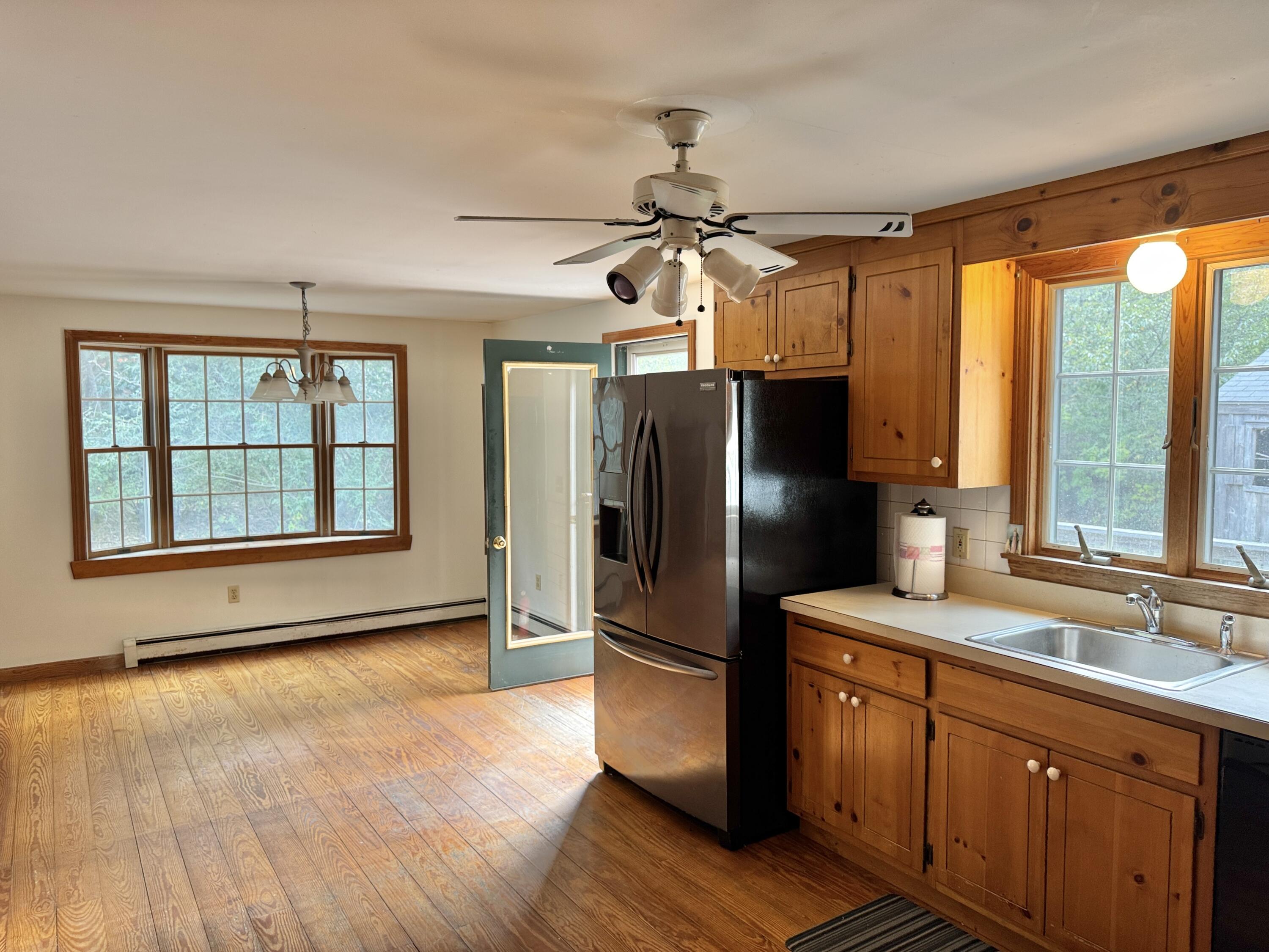 255 Massasoit Road Eastham, MA 02642 - Photo 9 of 25 a kitchen with stainless steel appliances granite countertop a refrigerator a sink and a stove