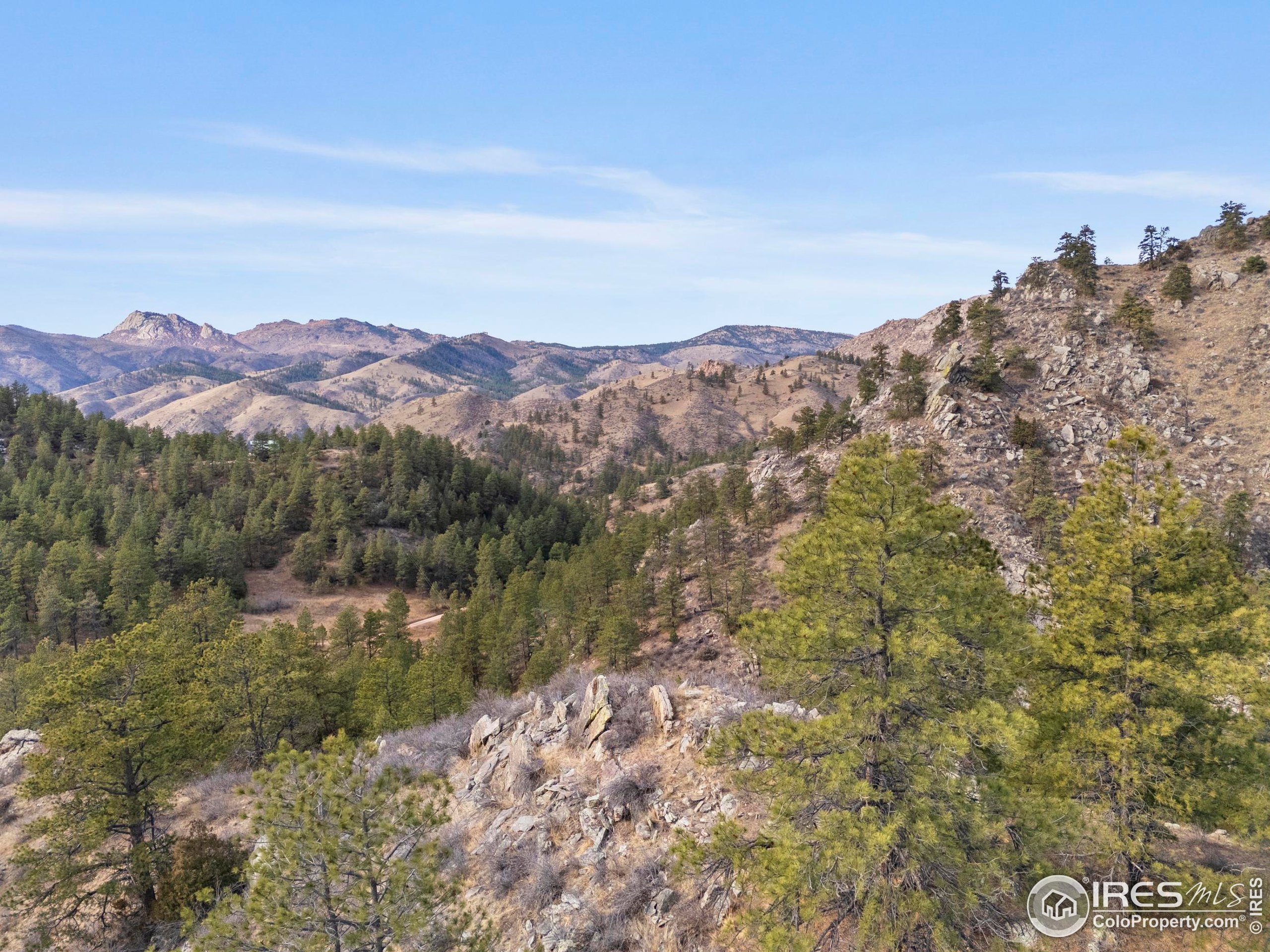 5771 Obenchain Road Laporte, CO 80535 - Photo 23 of 39 a view of a town with mountains in the background