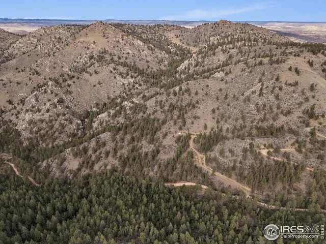 a view of a town with mountains in the background