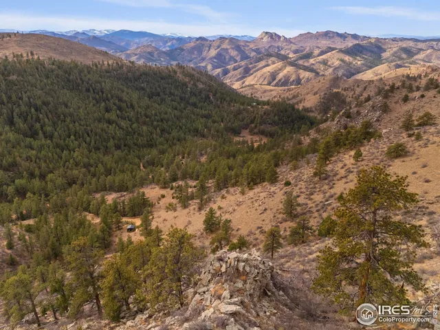 a view of a city with mountains in the background