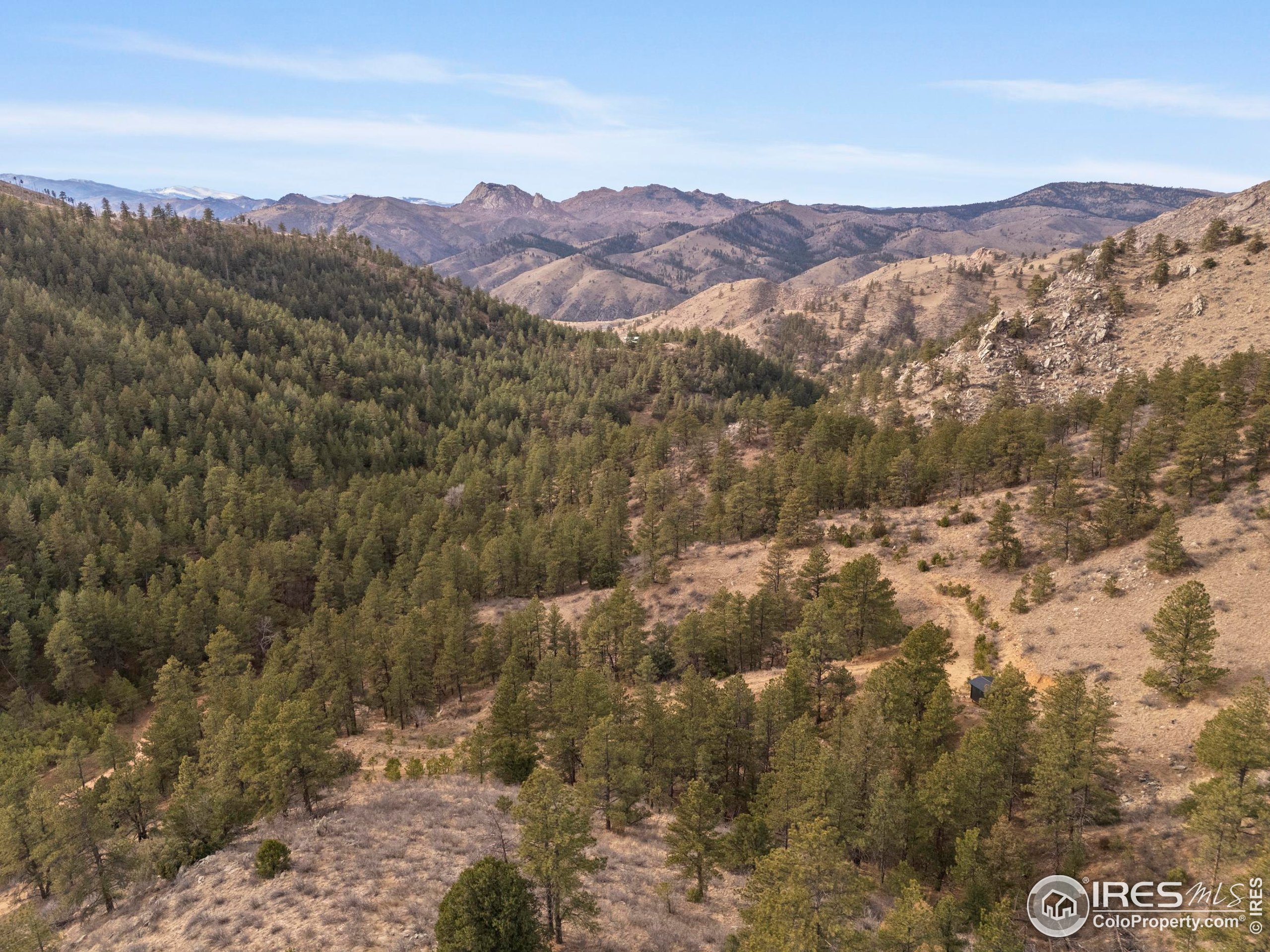 5771 Obenchain Road Laporte, CO 80535 - Photo 31 of 39 a view of a city with mountains in the background