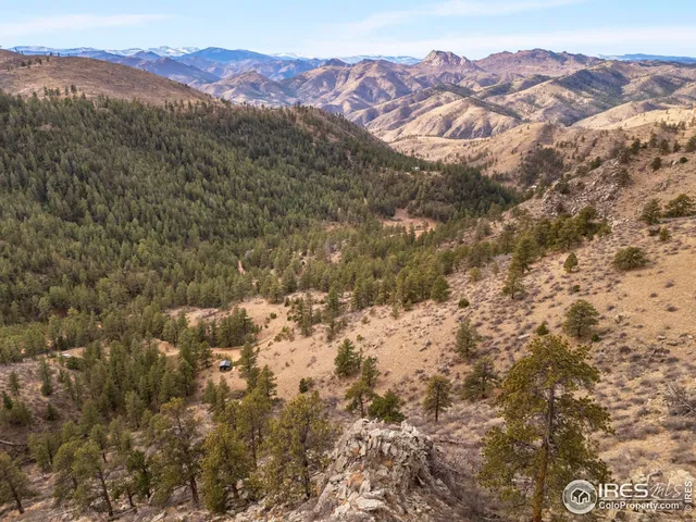 an aerial view of residential house and green space