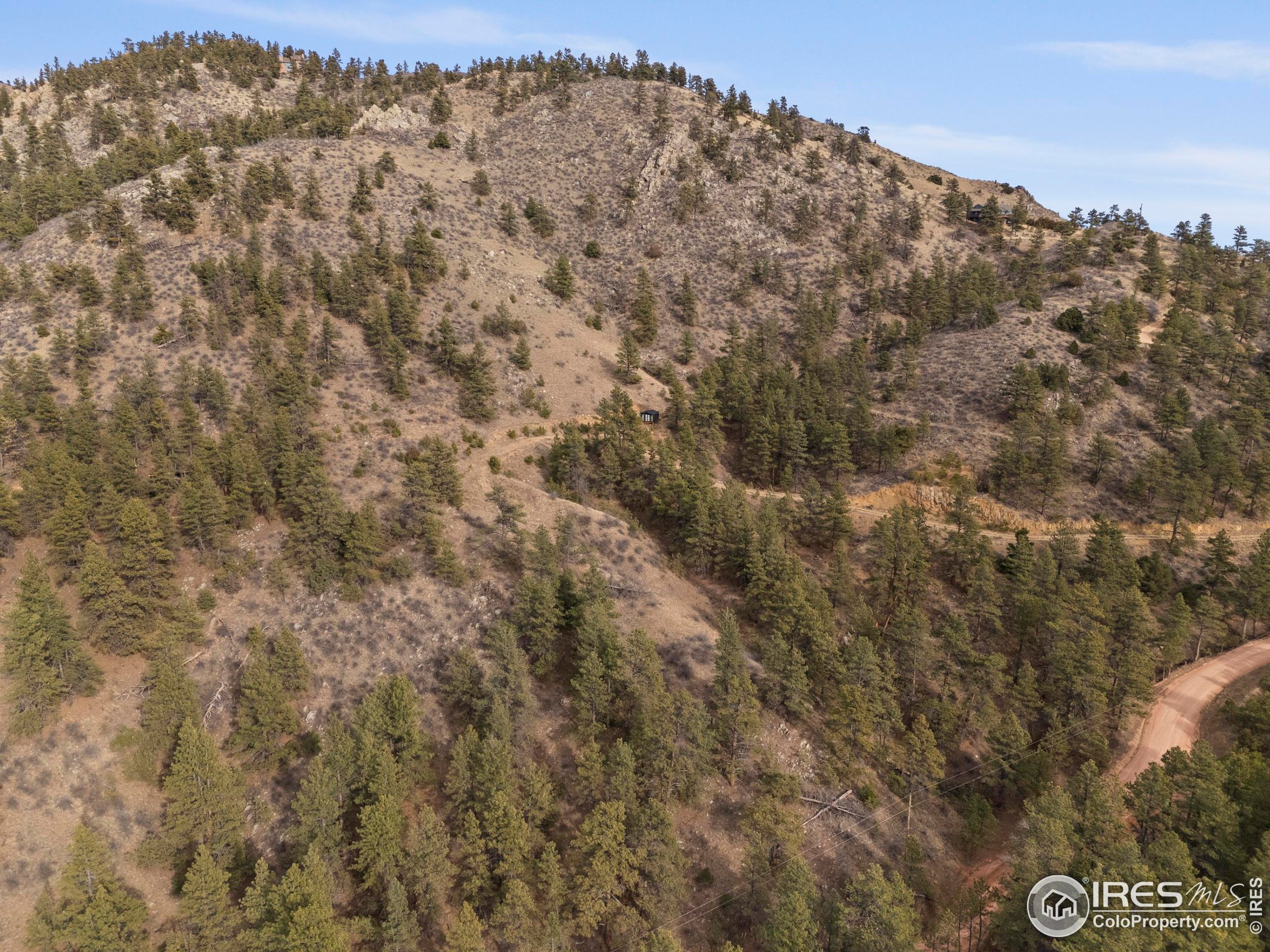 5771 Obenchain Road Laporte, CO 80535 - Photo 34 of 39 a view of a large building with mountains in the background