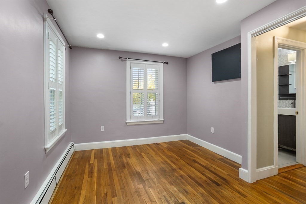 140 Lowell Street Lexington, MA 02420 - Photo 18 of 37 wooden floor in an empty room with a window