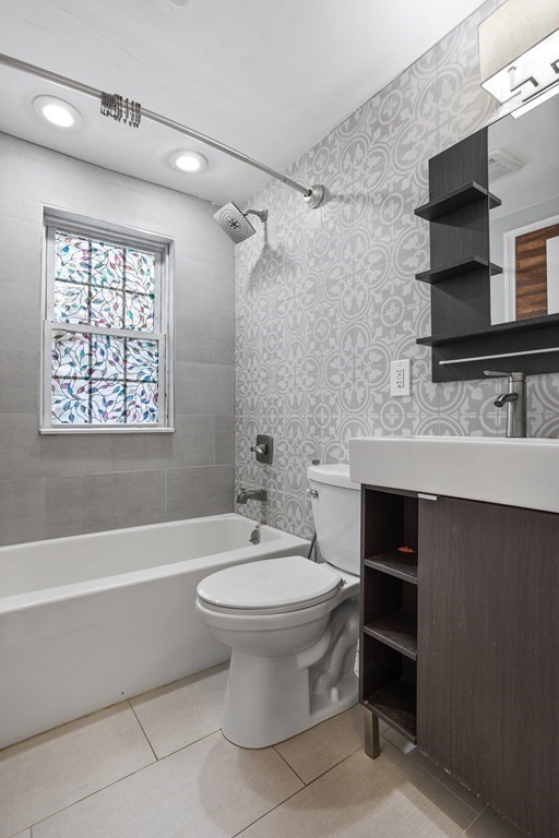 140 Lowell Street Lexington, MA 02420 - Photo 20 of 37 a bathroom with a sink toilet a mirror and shower