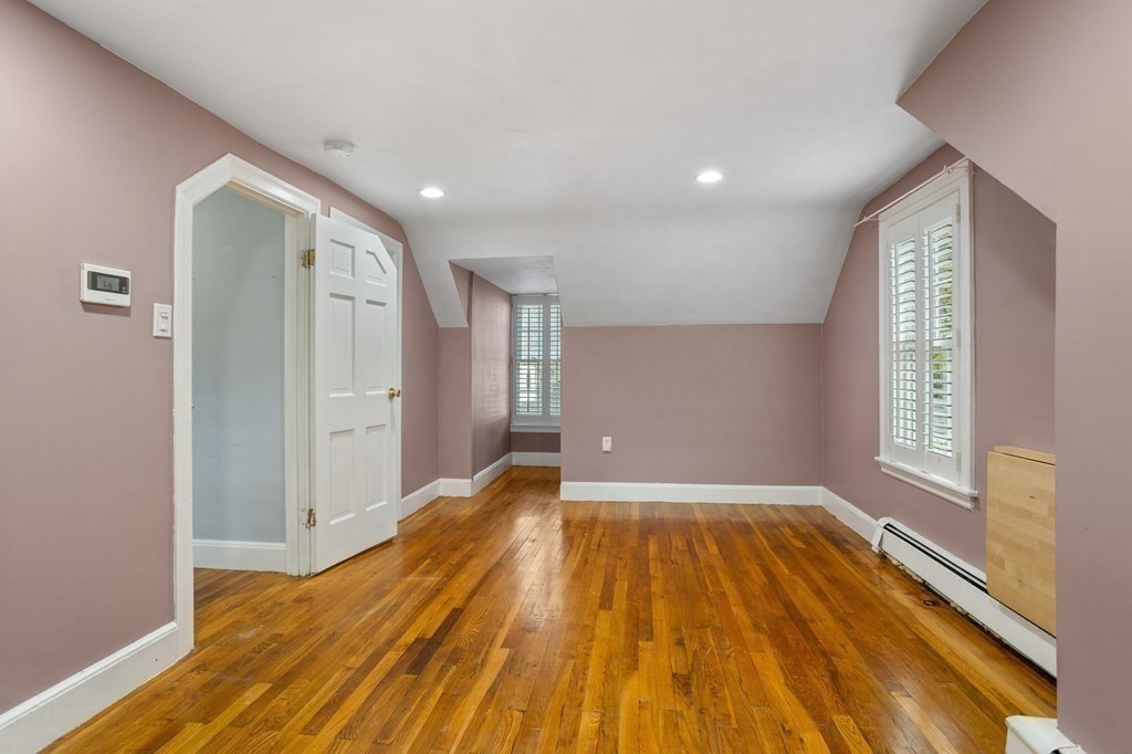140 Lowell Street Lexington, MA 02420 - Photo 27 of 37 a view of empty room with wooden floor and fan