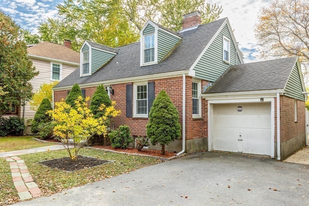 140 Lowell Street Lexington, MA 02420 - Photo 34 of 37 a front view of a house with garden