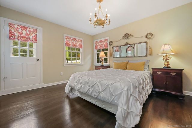 a bed room with a bed and a window