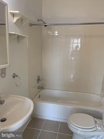a bathroom with a toilet and a bathtub