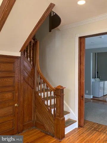 a view of entryway with wooden floor