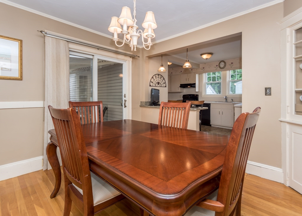 48 Bruce Road Waltham, MA 02453 - Photo 12 of 39 a dining room with furniture a chandelier and wooden floor