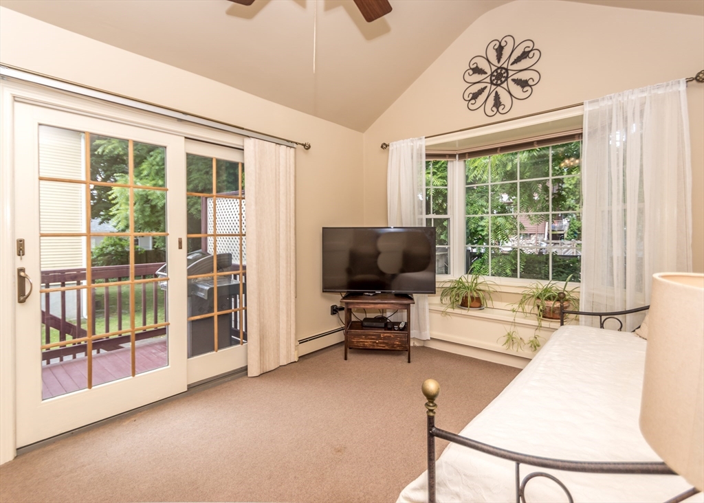 48 Bruce Road Waltham, MA 02453 - Photo 21 of 39 a living room with furniture and a flat screen tv