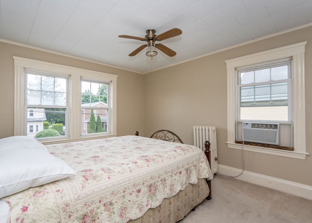 48 Bruce Road Waltham, MA 02453 - Photo 25 of 39 a bedroom with a large bed and a window