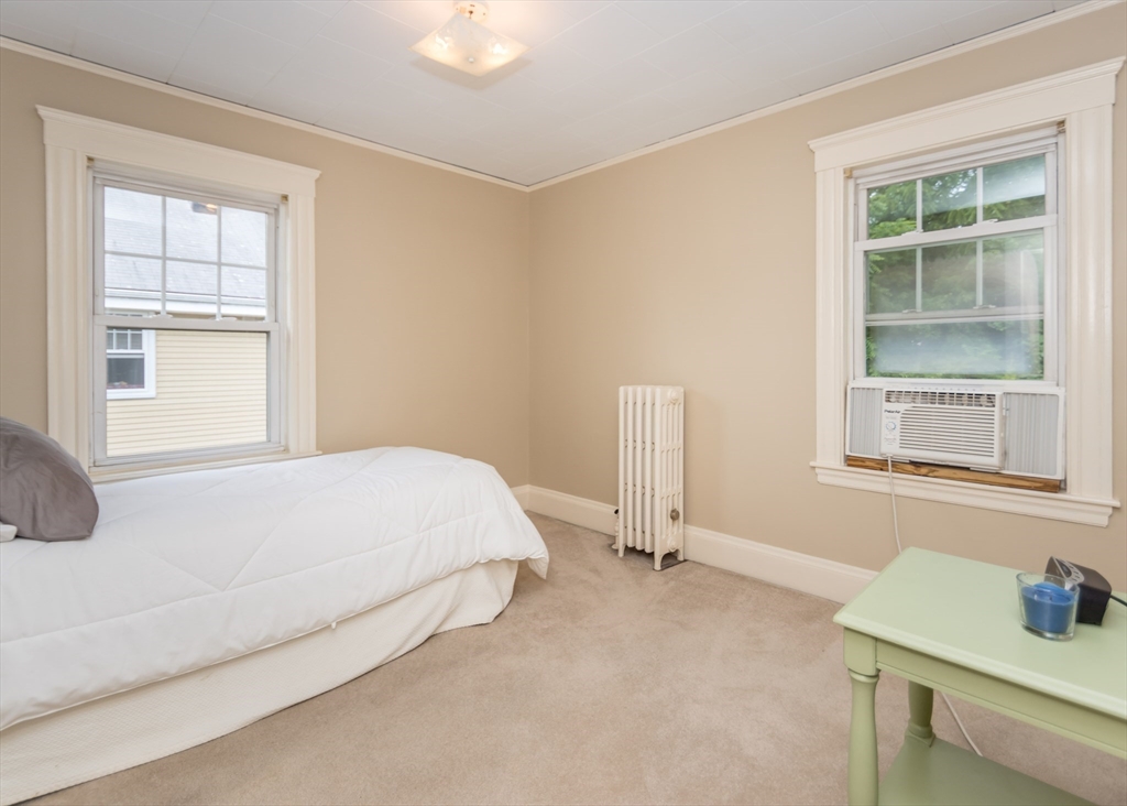 48 Bruce Road Waltham, MA 02453 - Photo 26 of 39 a bedroom with a bed and a window