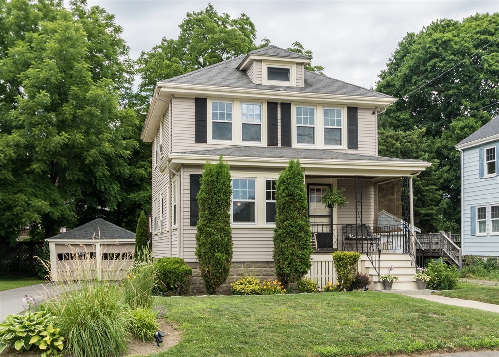 48 Bruce Road Waltham, MA 02453 - Photo 3 of 39 a front view of a house with a yard