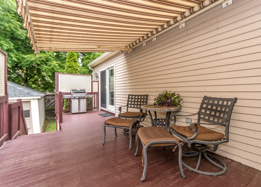 48 Bruce Road Waltham, MA 02453 - Photo 34 of 39 a patio with table and chairs and potted plants