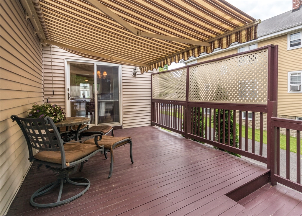 48 Bruce Road Waltham, MA 02453 - Photo 35 of 39 a balcony with furniture and wooden floor