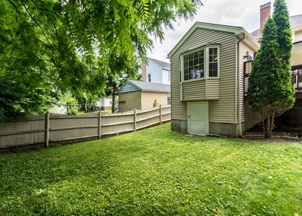48 Bruce Road Waltham, MA 02453 - Photo 38 of 39 a view of a house with a backyard