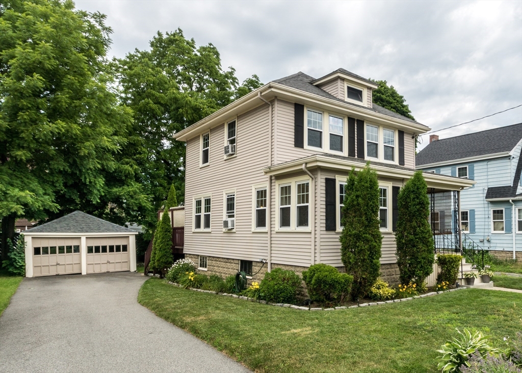 48 Bruce Road Waltham, MA 02453 - Photo 4 of 39 a front view of a house with a yard and trees