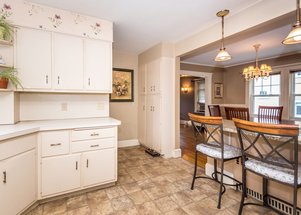 48 Bruce Road Waltham, MA 02453 - Photo 8 of 39 a view of kitchen with cabinets and outdoor seating