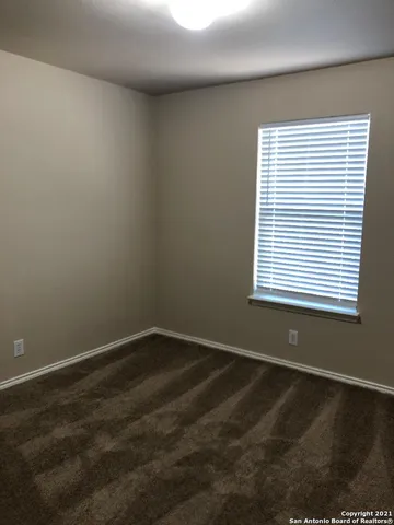 a view of a room with a window