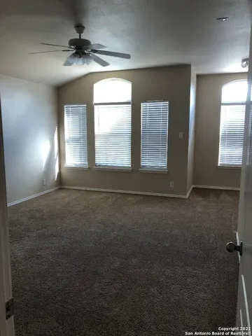 an empty room with a empty space and windows