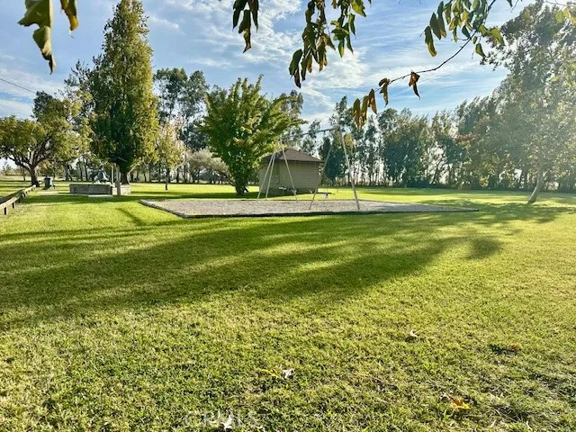 a view of a water fountain and a big yard