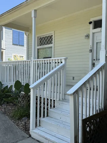 a view of a balcony with wooden floor