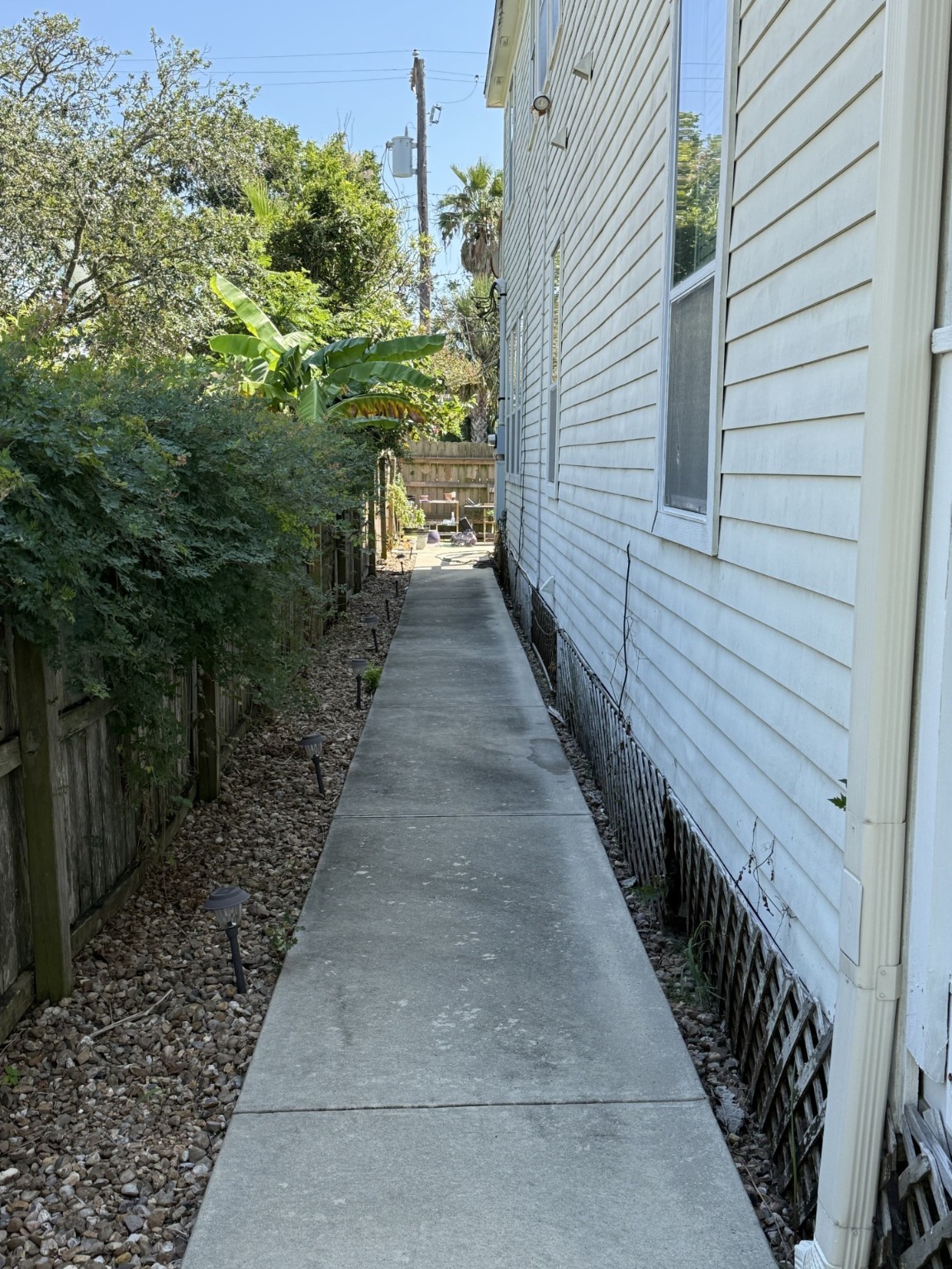 1519 Avenue M, Unit DOWN Galveston, TX 77550 - Photo 3 of 9 a view of a pathway of a house with wooden floor