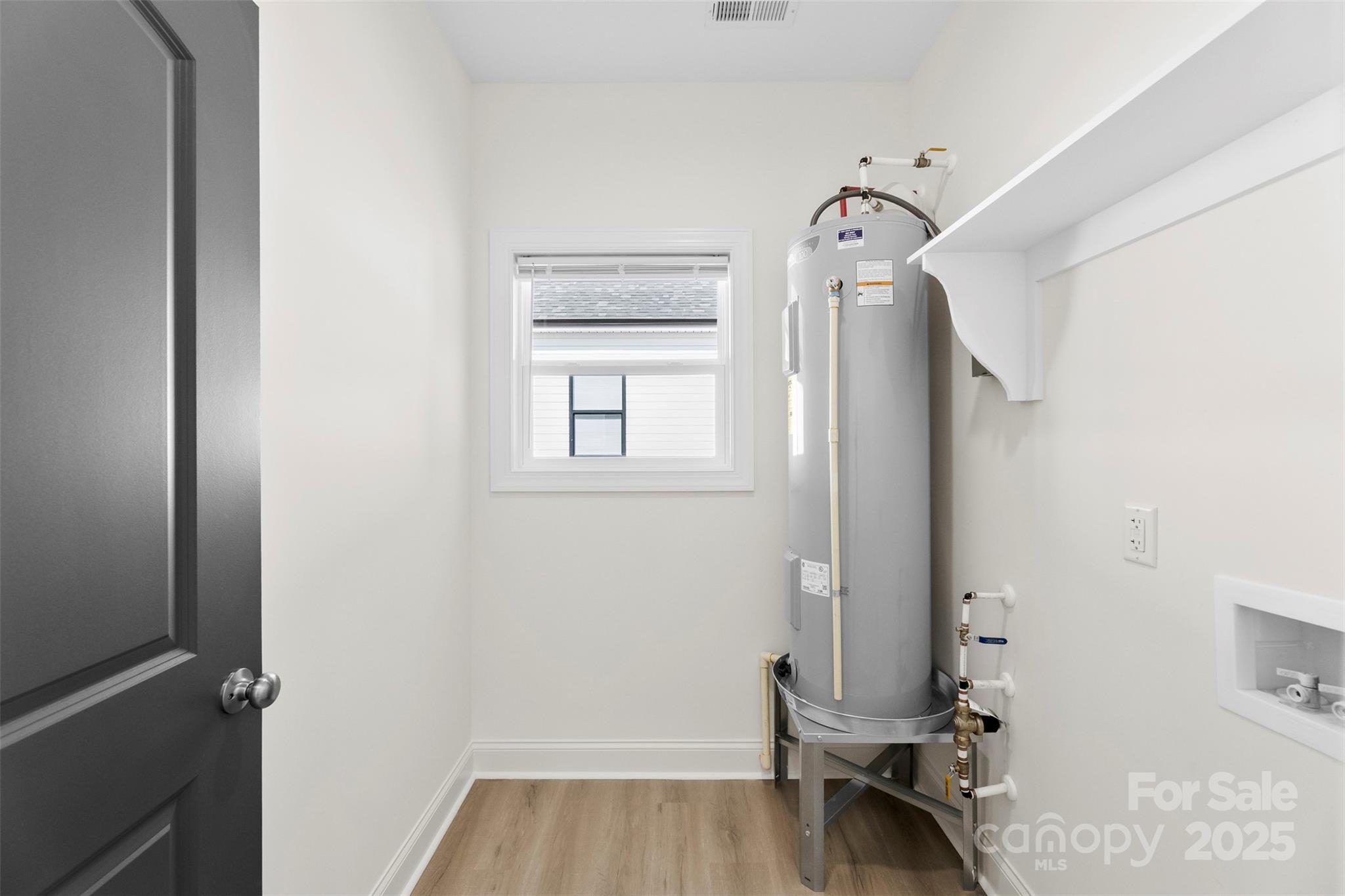 215 Benfield Road Kings Mountain, NC 28086 - Photo 14 of 25 a view of a livingroom with wooden floor and a window