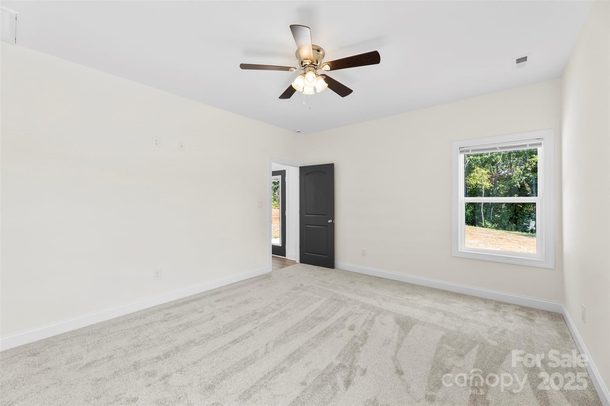 215 Benfield Road Kings Mountain, NC 28086 - Photo 16 of 25 an empty room with fan and windows