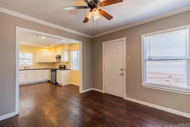 a view of a kitchen with a sink and a window
