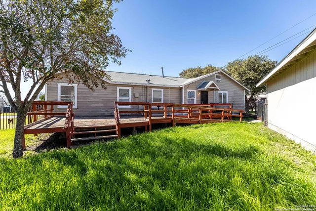a backyard of a house with seating space