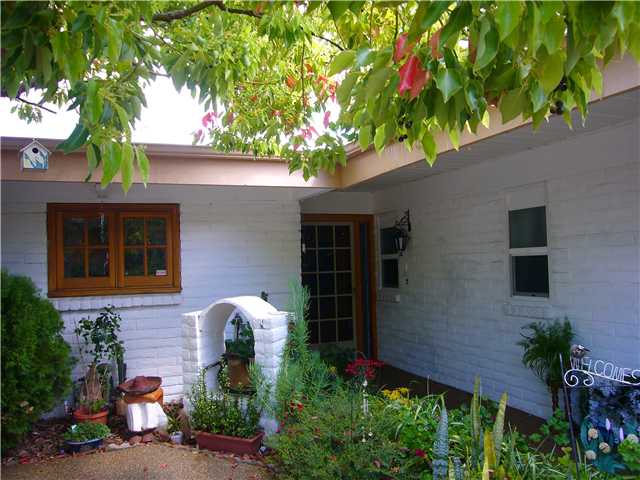 1330 East Fallbrook Street Fallbrook, CA 92028 - Photo 1 of 22 Beautiful wood windows and Slump-block exterior.