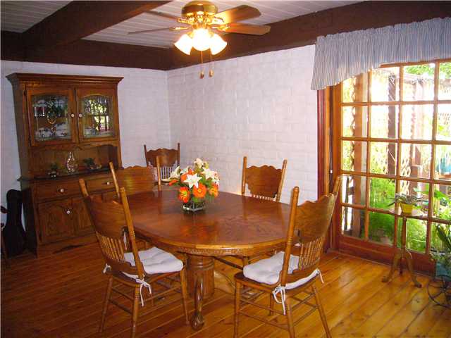 1330 East Fallbrook Street Fallbrook, CA 92028 - Photo 3 of 22 Very spacious Dining Room with wood flooring, overhead beams and an oversized wood slider to access outside patio. Don't miss the wood stove tucked in the corner.