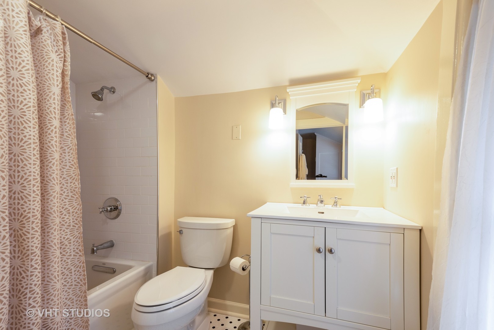 171 Church Road Winnetka, IL 60093 - Photo 14 of 16 a bathroom with a sink a toilet a mirror a vanity and shower